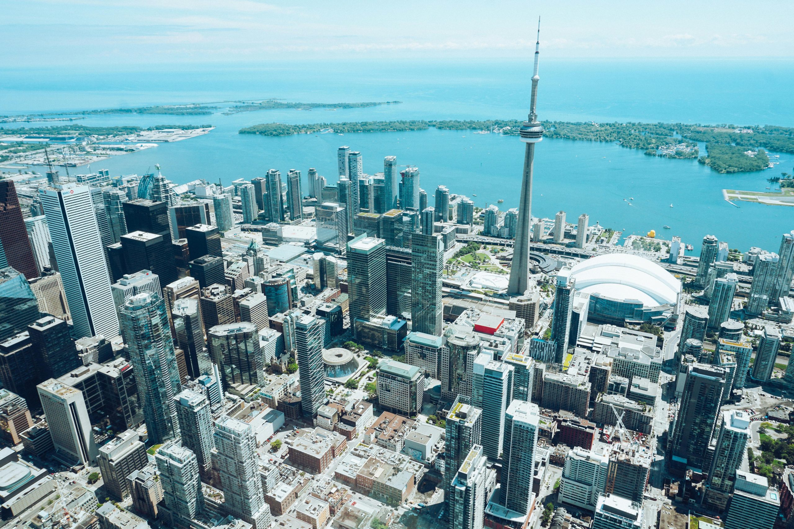 Stunning aerial view of Toronto's skyline featuring the iconic CN Tower on a sunny day.